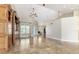 Open-concept living space featuring tile floors, high ceilings, and a built-in entertainment unit at 10835 Se Highway 464C, Ocklawaha, FL 32179