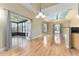 Bright and open living room shows access to screen patio and kitchen at 10835 Se Highway 464C, Ocklawaha, FL 32179