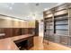 Elegant office features custom cabinets, desk, recessed lighting, and vinyl flooring at 10835 Se Highway 464C, Ocklawaha, FL 32179