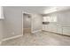 Room features tile floors, neutral colored walls, white cabinets and a window at 10835 Se Highway 464C, Ocklawaha, FL 32179