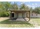 View of shed with a covered area offering practical space for storage or workshop projects at 10835 Se Highway 464C, Ocklawaha, FL 32179