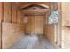 The interior of the shed features plywood walls, wood floors and a window at 10835 Se Highway 464C, Ocklawaha, FL 32179