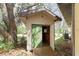 The shed features painted wood walls and a green door at 10835 Se Highway 464C, Ocklawaha, FL 32179