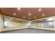 Bright dance studio featuring mirrored walls, soft yellow paint, and recessed lighting for a modern feel at 10835 Se Highway 464C, Ocklawaha, FL 32179