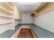 Spacious walk-in closet with built-in shelving, cabinets, and ample storage space at 10835 Se Highway 464C, Ocklawaha, FL 32179