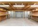 Workshop interior with built-in shelving and worktables, illuminated by fluorescent lights at 10835 Se Highway 464C, Ocklawaha, FL 32179