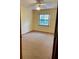 Bedroom featuring carpet floors and a window to let in natural light at 1112 Ne 130Th Ter, Silver Springs, FL 34488