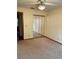 Bedroom featuring carpet floors, mirrored closet doors, and neutral colored walls at 1112 Ne 130Th Ter, Silver Springs, FL 34488