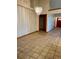 Spacious dining room with tile flooring and modern chandelier at 1112 Ne 130Th Ter, Silver Springs, FL 34488