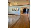 Bright foyer with ceramic tile flooring, decorative wall cutouts, and an ornate white railing at 1112 Ne 130Th Ter, Silver Springs, FL 34488