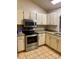 Modern kitchen features stainless steel appliances and plenty of storage space at 1112 Ne 130Th Ter, Silver Springs, FL 34488