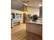 Bright kitchen with stainless steel appliances, breakfast bar, tile floors, and adjacent dining space at 1112 Ne 130Th Ter, Silver Springs, FL 34488