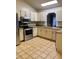 Well-lit kitchen featuring stainless steel appliances, ample counter space, and tile backsplash at 1112 Ne 130Th Ter, Silver Springs, FL 34488