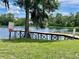 Community lake pier with lake view and benches for residents at 1112 Ne 130Th Ter, Silver Springs, FL 34488