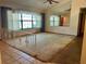 Bright living room with a large window and a decorative railing at 1112 Ne 130Th Ter, Silver Springs, FL 34488