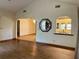 Open-concept living room with hardwood floors and access to the kitchen area at 1112 Ne 130Th Ter, Silver Springs, FL 34488