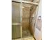 Shower stall with patterned tile, glass door, and chrome fixtures at 1112 Ne 130Th Ter, Silver Springs, FL 34488