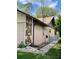 Side exterior of the house showing a fence and landscaping at 1112 Ne 130Th Ter, Silver Springs, FL 34488