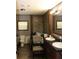 Bathroom featuring double sinks and a stylish vanity at 11160 Nw 8Th Ln, Ocala, FL 34482