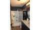 Bathroom featuring a shower-tub combo and dark modern vanity at 11160 Nw 8Th Ln, Ocala, FL 34482