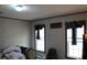 Bedroom featuring two windows and custom curtains at 11160 Nw 8Th Ln, Ocala, FL 34482