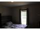Bedroom featuring a window and standard decor at 11160 Nw 8Th Ln, Ocala, FL 34482