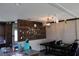 Bright dining area with wood accent wall and modern light fixture at 11160 Nw 8Th Ln, Ocala, FL 34482