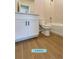 Cozy bathroom featuring a vanity cabinet, ceramic toilet, and bathtub shower combo at 13145 Sw 78Th Cir, Ocala, FL 34473