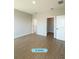 Spacious bedroom with wood-look tile flooring and ample closet space at 13145 Sw 78Th Cir, Ocala, FL 34473