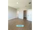 Spacious bedroom with wood-look tile flooring and ample closet space at 13145 Sw 78Th Cir, Ocala, FL 34473