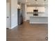 Open-concept kitchen featuring stainless steel appliances, a center island, and sleek countertops at 13145 Sw 78Th Cir, Ocala, FL 34473