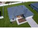 Aerial view of a home showcasing its architectural layout, green landscaping, and welcoming curb appeal at 13239 Sw 60Th Avenue Rd, Ocala, FL 34473
