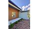 Side exterior view showcasing modern architectural design, landscaping, and a well-maintained yard at 13239 Sw 60Th Avenue Rd, Ocala, FL 34473