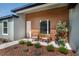 Inviting front porch with modern chairs and a charming landscape at 13239 Sw 60Th Avenue Rd, Ocala, FL 34473