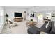 The living room boasts a comfortable seating area with stylish furniture and plenty of natural light at 1703 Sw 159 Ct, Ocala, FL 34481
