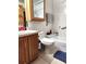 Functional bathroom with white tile, oak vanity, and combined tub and shower at 17051 Ne 243Rd Place Rd, Fort Mc Coy, FL 32134