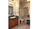 Well-lit bathroom featuring accessible features, tiled floors, and a vanity at 17051 Ne 243Rd Place Rd, Fort Mc Coy, FL 32134