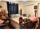 Bedroom featuring a bed with wood frame and drawers, and a white closet at 17051 Ne 243Rd Place Rd, Fort Mc Coy, FL 32134