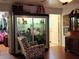 Bedroom featuring a display cabinet, hardwood floors, and natural lighting at 17051 Ne 243Rd Place Rd, Fort Mc Coy, FL 32134