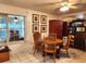 Bright dining area with a charming wooden table, chairs, and window views at 17051 Ne 243Rd Place Rd, Fort Mc Coy, FL 32134