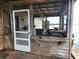 Exterior view of a waterfront structure with a screened porch at 17051 Ne 243Rd Place Rd, Fort Mc Coy, FL 32134