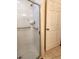 Clean shower with grab bars, tiled walls, and a glass door in renovated bathroom at 17051 Ne 243Rd Place Rd, Fort Mc Coy, FL 32134