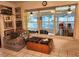 Sun-drenched sun room features tiled floors, a comfortable chair, and windows at 17051 Ne 243Rd Place Rd, Fort Mc Coy, FL 32134
