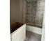 Bathroom in progress with a modern tub and tiled shower surround, complemented by a vanity cabinet at 21712 Sw Rainbow Lakes Blvd, Dunnellon, FL 34431