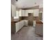 Unfinished kitchen featuring modern white cabinets, ready for appliances and countertops, filled with natural light at 21712 Sw Rainbow Lakes Blvd, Dunnellon, FL 34431