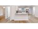 Modern kitchen featuring granite countertops, stainless steel appliances, and seamless transition to the living space at 2264 Sw Moines Ct, Dunnellon, FL 34431