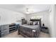 Bedroom featuring neutral walls, carpet, ceiling fan, and a comfy bed at 2413 Se 23Rd St, Ocala, FL 34471