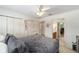Bedroom with carpet, ceiling fan, and access to an ensuite bathroom at 2413 Se 23Rd St, Ocala, FL 34471