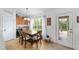 Breakfast nook with wood table set, large window, and access to the backyard at 2413 Se 23Rd St, Ocala, FL 34471