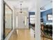 Inviting foyer featuring wood floors, decorative lighting, and mirrors for a welcoming ambiance at 2413 Se 23Rd St, Ocala, FL 34471